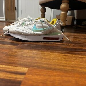 Nike White Sneakers with Turquoise Swoosh and Yellow Lining